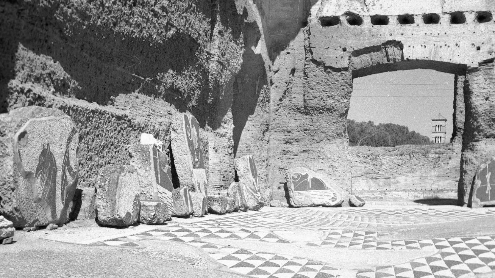 News - Features - Urban Legacy Black and white photographs of an ancient Roman ruins showing a brick wall and mosaic floor