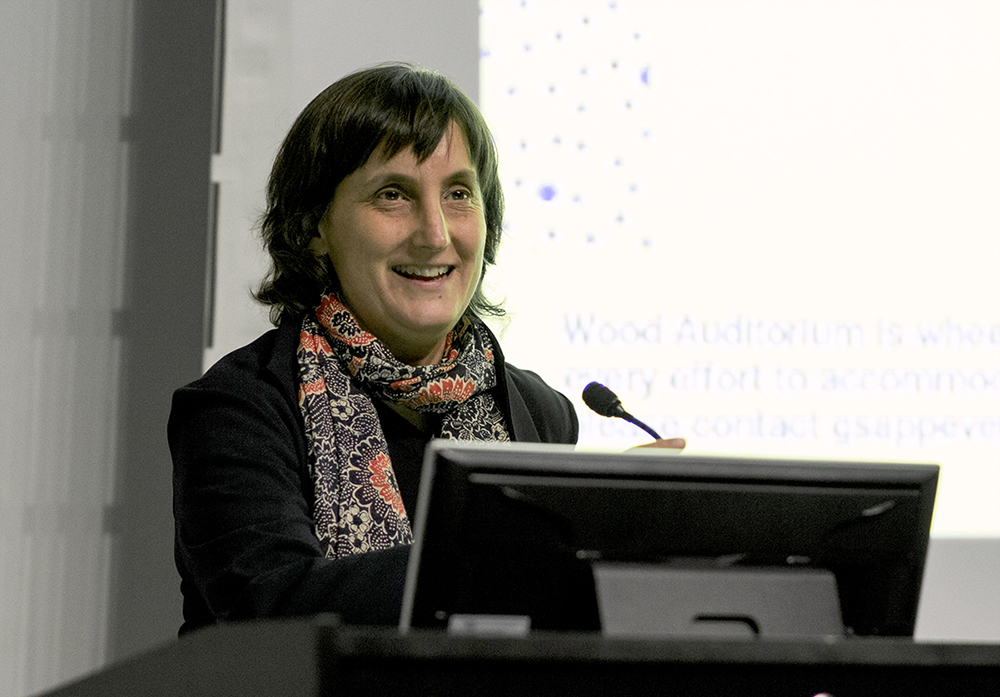 Laura Kurgan Color photograph of Laura Kurgan speaking from a lecture podium