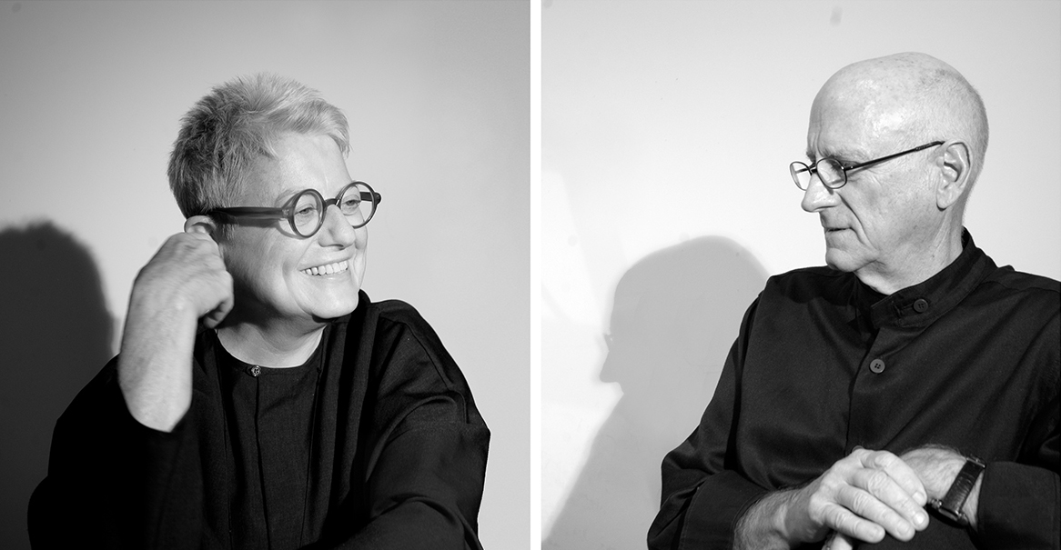 Mack Scogin and Merrill Elam Two black and white photographs side by side; on the left is a light skinned woman wearing glasses, on the right is a light skinned man wearing glasses