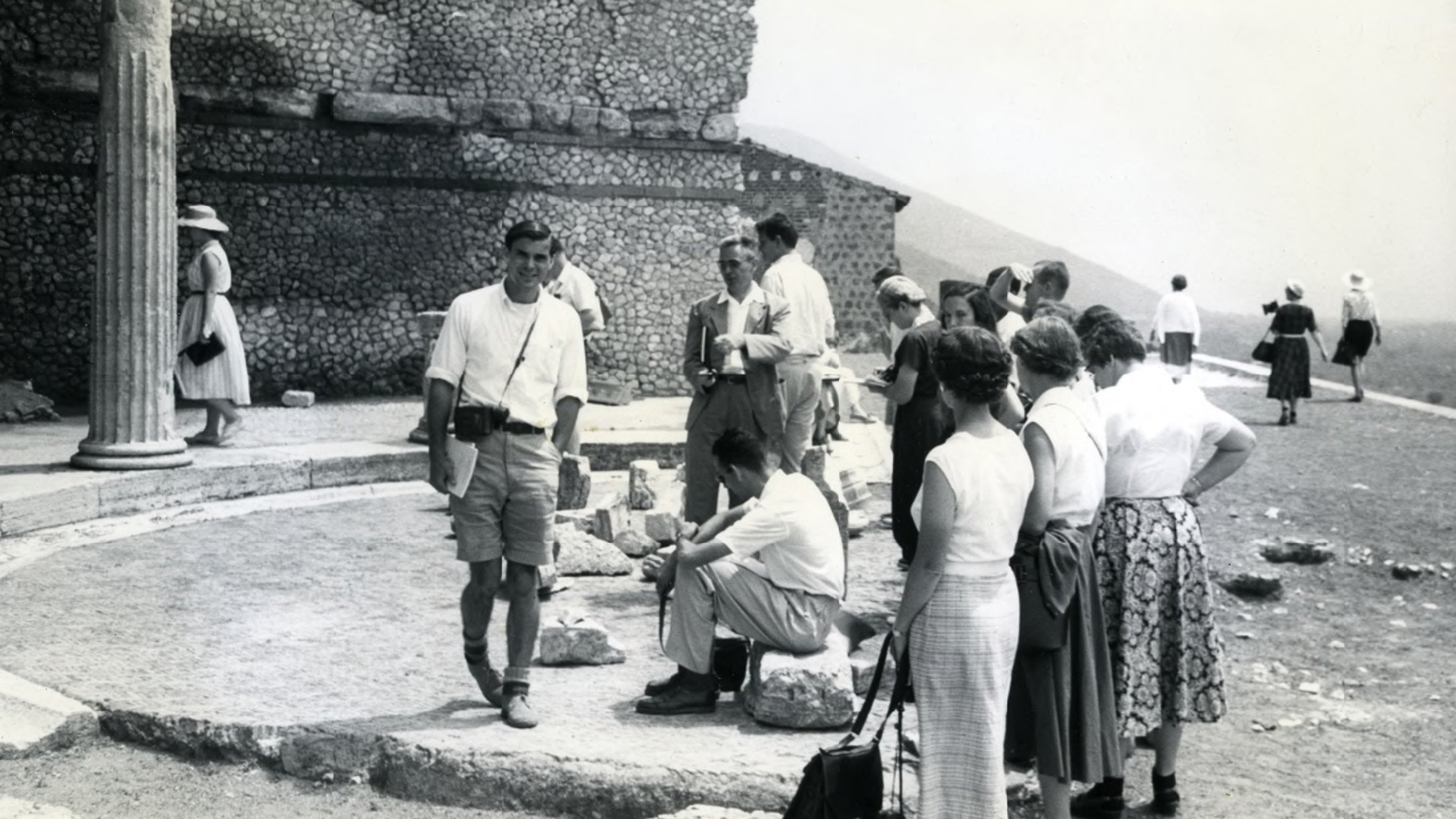 Black and white photograph of men and women in an outdoor location in Italy