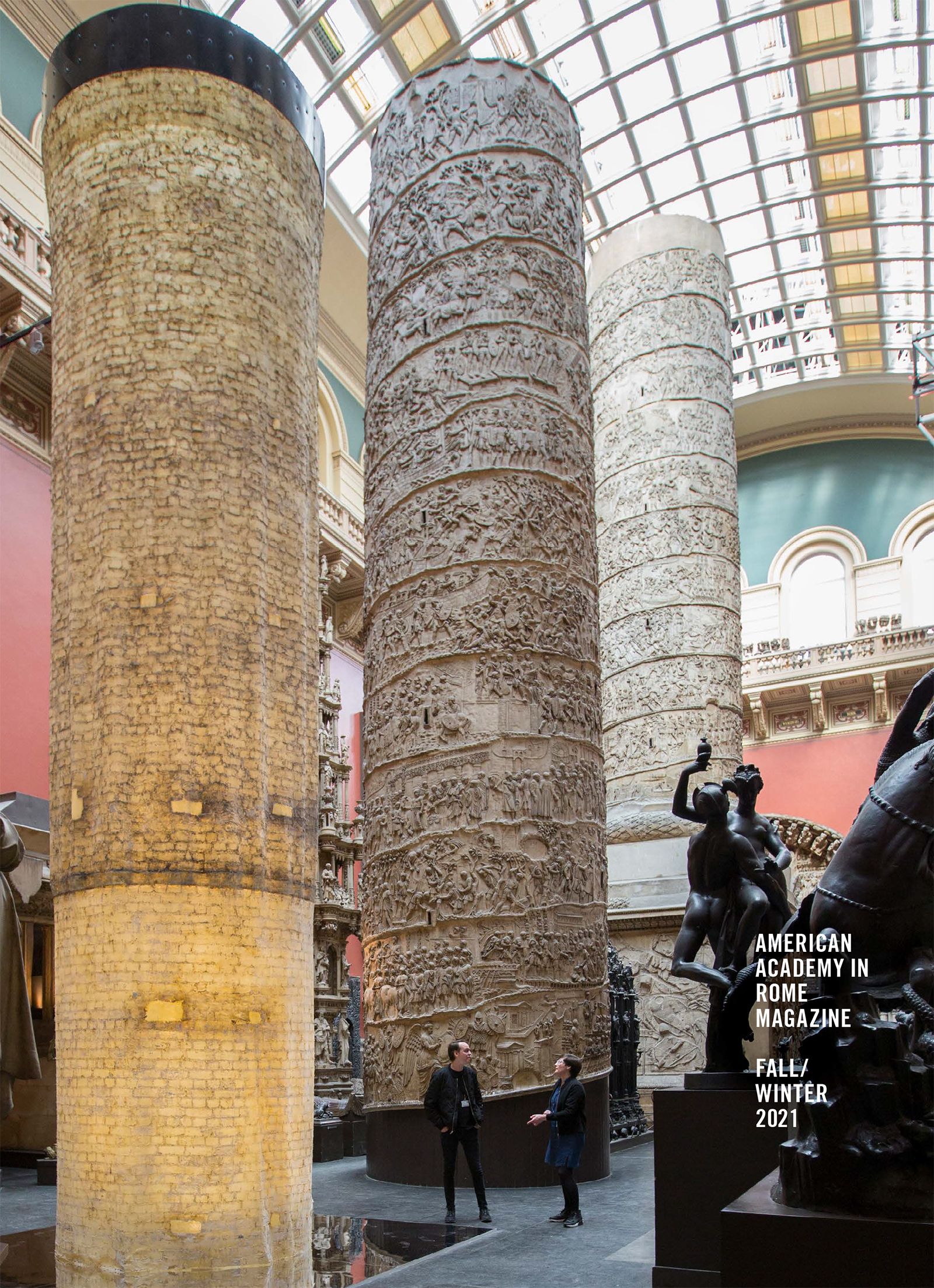 AAR Magazine Fall Winter 2021 Cover of the Fall/Winter issue of AAR Magazine, with a color photograph depicting a large room inside the Victoria and Albert Museum with two halves of a cast of Trajan's Column behind a cylindrical latex cast of the interior of one of the columns; two men stand talking between them, dwarfed by the immense scale of the column