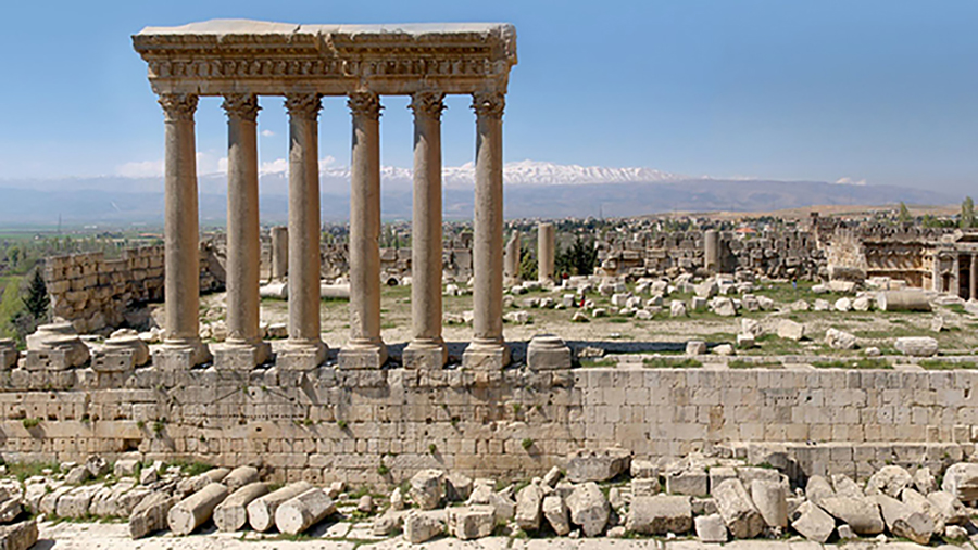 Detail of a book cover with a color photograph showing a site of ancient Roman ruins (including five columns supporting an architrave) on a sunny day