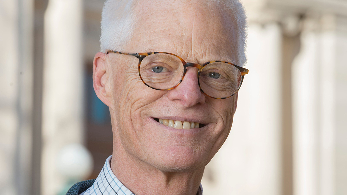 Color photograph of the face of Thomas Gordon Smith, smiling and wearing glasses