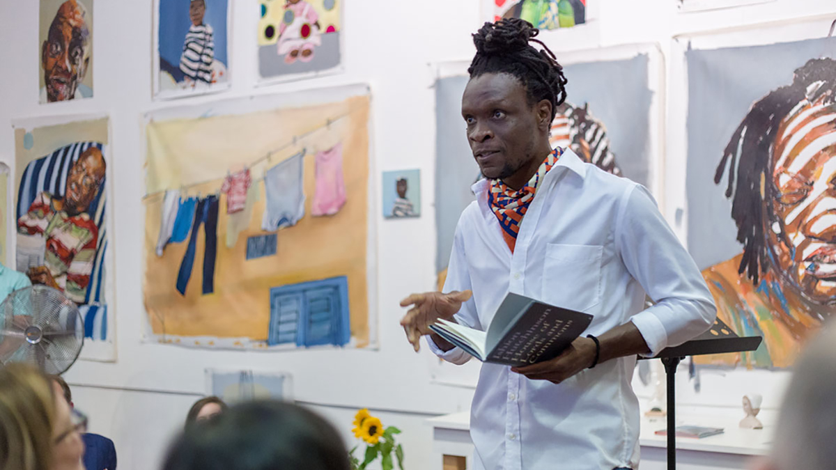 The poet Ishion Hutchinson reading his work in the studio of painter Beverly McIver during 2018 Open Studios at the American Academy in Rome